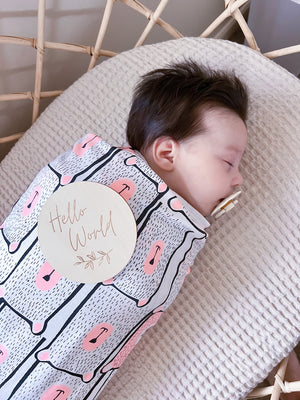 Koala Hugs newborn swaddle wrap helps calm the startle reflex and keeps babies sleeping longer.