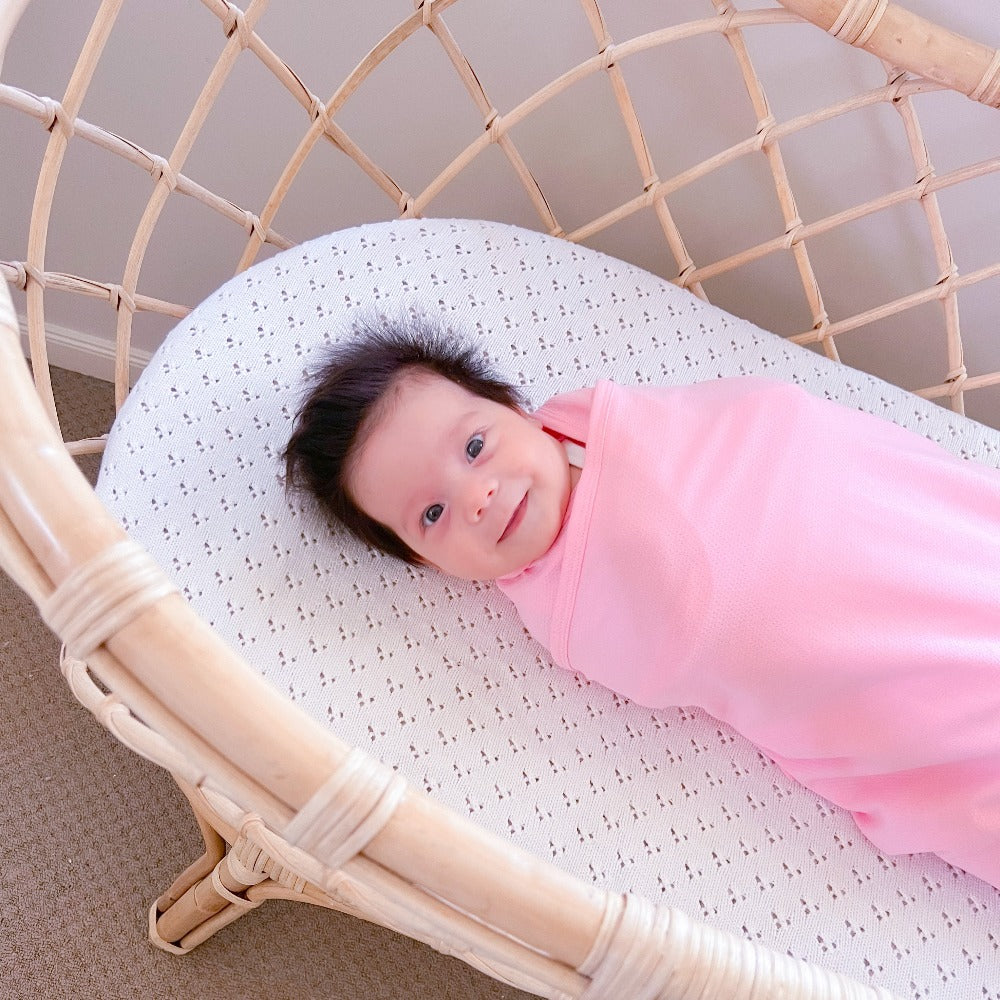 Koala Hugs newborn swaddle wrap gently cocoons baby's arms to help calm the startle reflex.