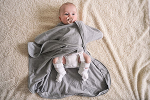 Transitional baby swaddle for hip dysplasia by Baby Loves Sleep