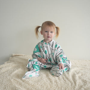 Toddler sleep onesie made of soft organic cotton with anti slip dots on feet covers