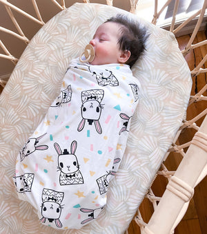 Koala Hugs newborn swaddle wrap helps calm the startle reflex and keeps babies sleeping longer.