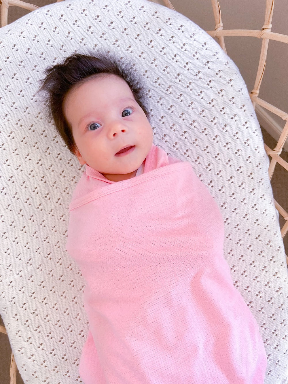 Koala Hugs newborn swaddle wrap gently cocoons baby's arms to help calm the startle reflex.