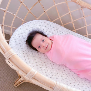 Koala Hugs newborn swaddle wrap gently cocoons baby's arms to help calm the startle reflex.