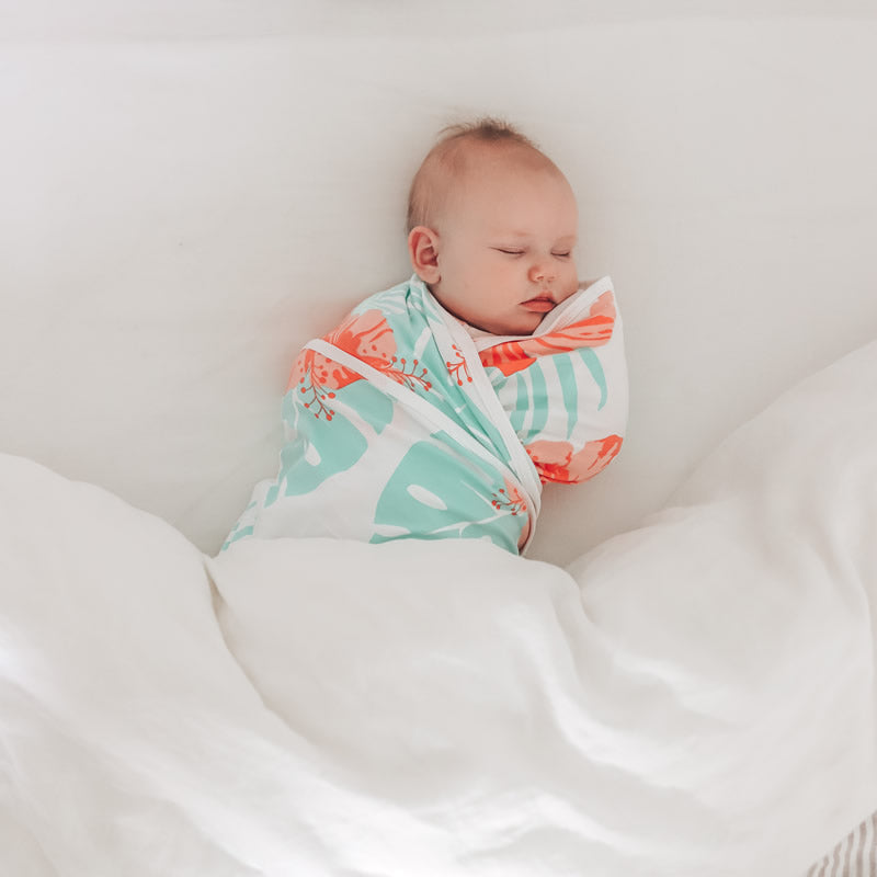 Koala Hugs newborn swaddle wraps gives security to help calm the startle reflex and keeps them sleeping longer.