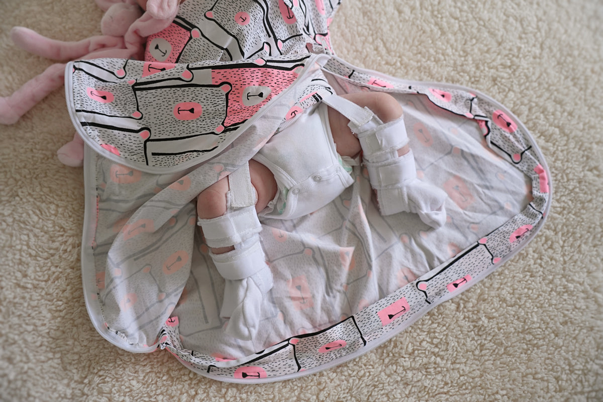Baby sleeping bag for babies wearing a Rhino brace